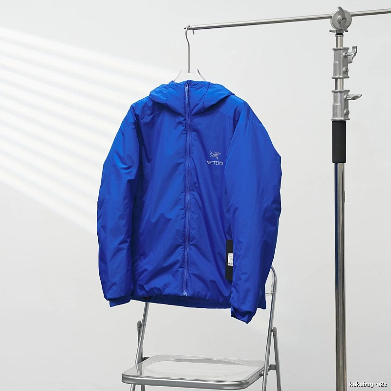Arc'teryx Royal Blue Lightweight Shell Jacket with vivid hooded finish and compact outdoor profile