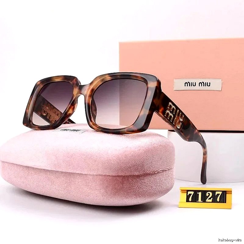 Miu Miu Relaxed Oversized sunglasses Black Oval Sunglasses with Designer-Inspired Detail